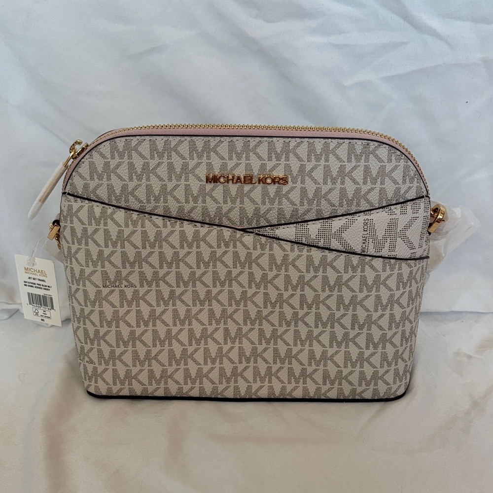 Michael Kors Logo Print Crossbody Bag in Cream, Tan, and Light Pink.